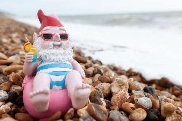 An Asda gnome relaxes by the sea outside the Wilson's home. Picture: Asda