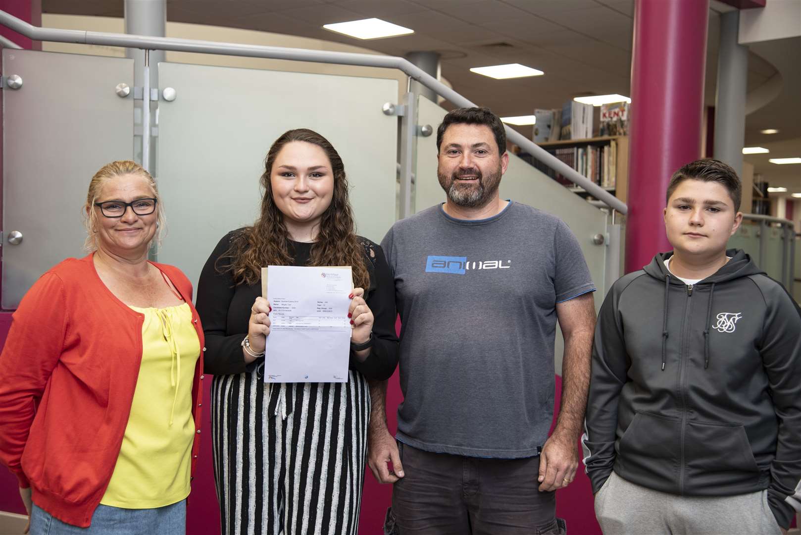 Megan Carr with her mum, dad and brother (15283152)