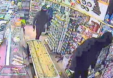 Two of the would-be robbers captured on CCTV entering the premises