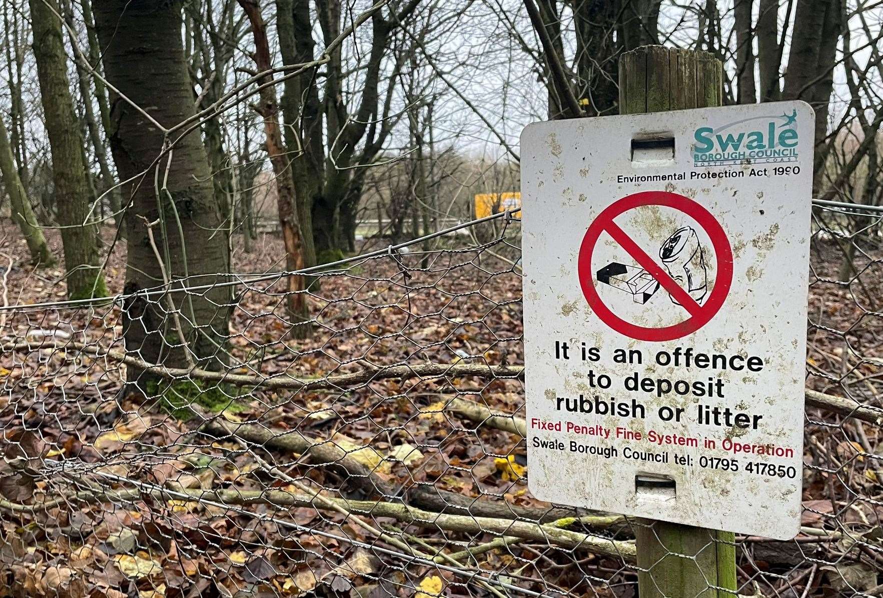 Swale council littering signs next to the public footpath which runs parallel to the A249