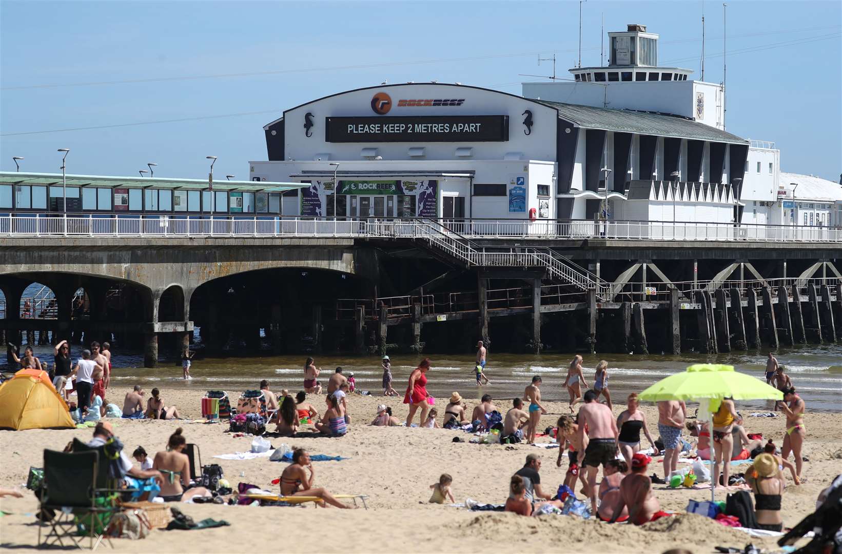 A sign saying ‘please keep two metres apart’ on Bournemouth Pier (Andrew Matthews/PA Wire)