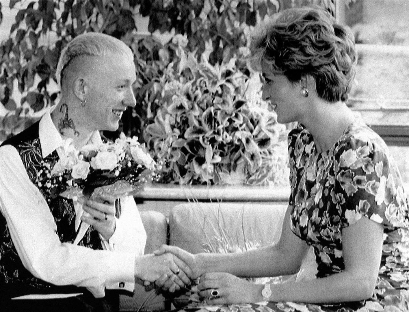 The Princess of Wales pictured in 2000 shaking hands with William Drake, a patient at London Lighthouse Aids Centre (PA)