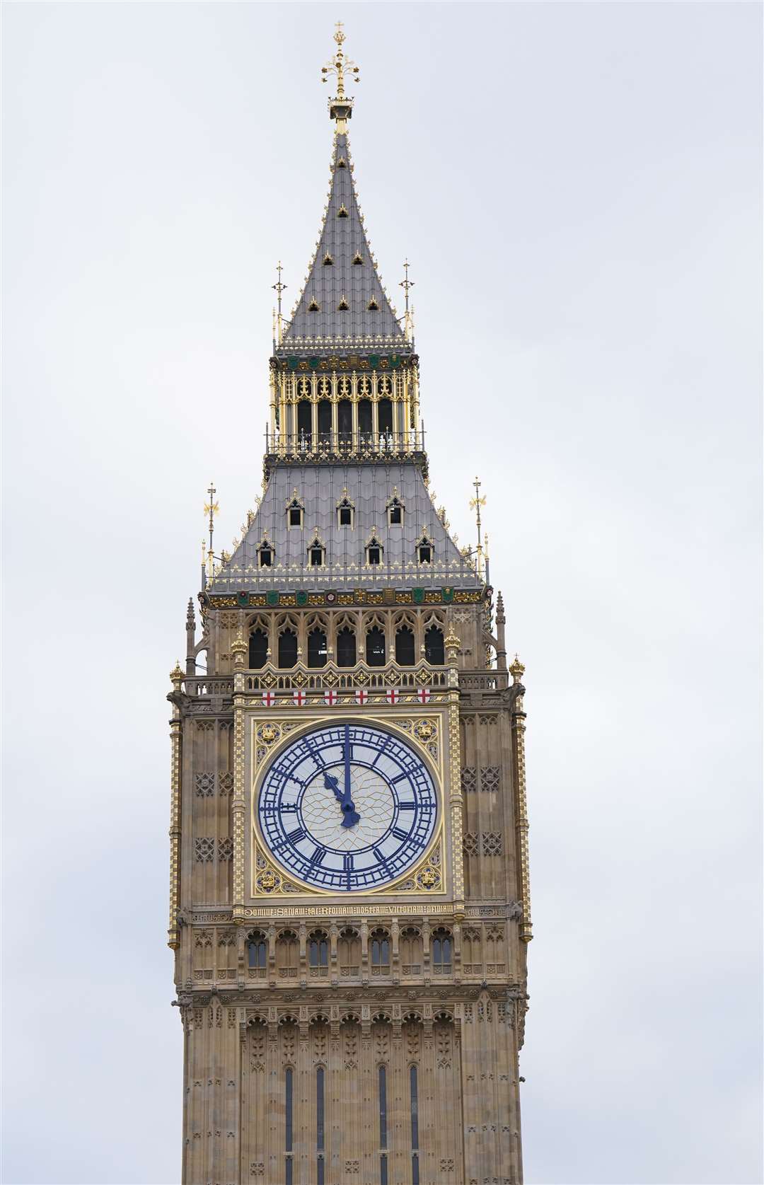 The clock face on Elizabeth Tower shows 11 o’clock as members of the public observe a two-minute silence in Parliament Square, Westminster (Jonathan Brady/PA)