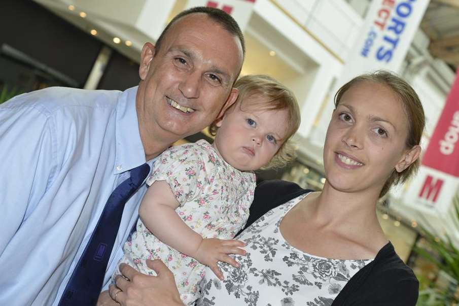 Jane Cook with 15-month-old Emily and Robbie Smith, who saved Emily’s life