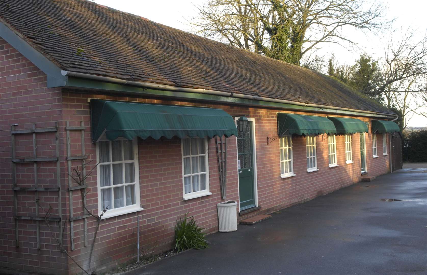 The lodges at the side of the main building - pictured here in 2009 - will be turned into hotel rooms during phase two of the project