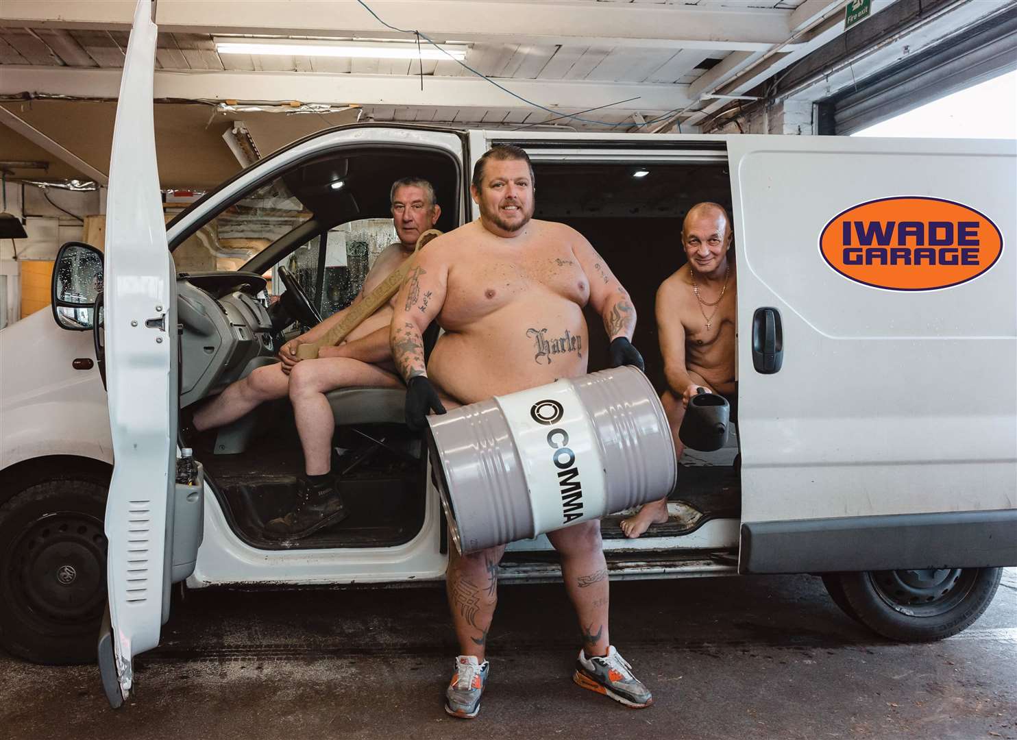 The men at Iwade Garage posing for the Iwade Naked Calendar 2019