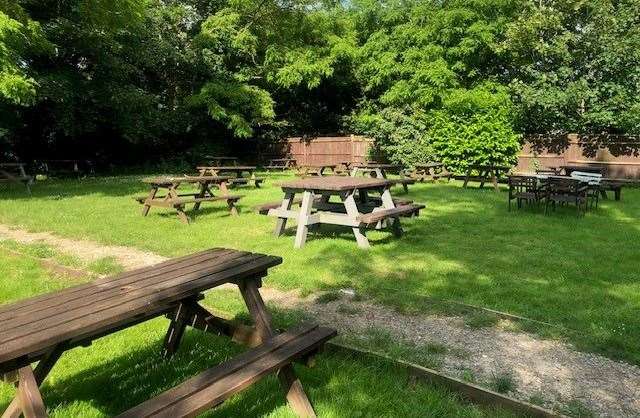 There’s plenty of greenery to be found at the far end of the pub garden with a large grassed area surround by established trees