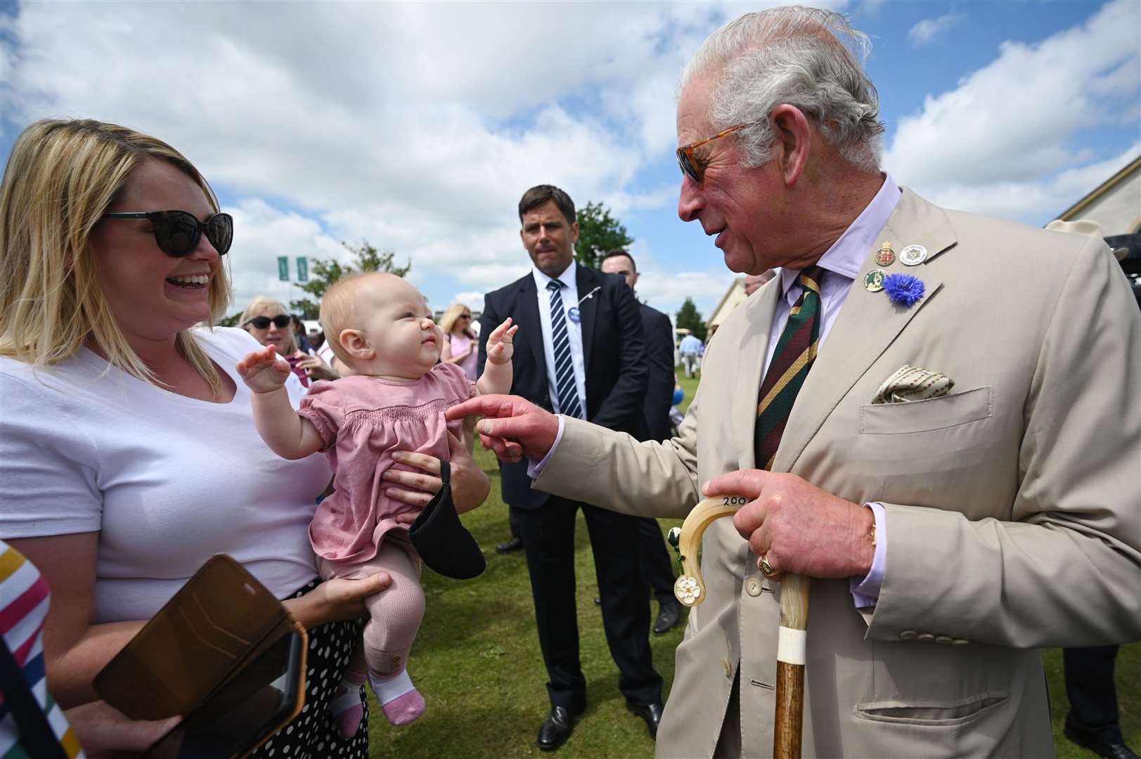 The Prince of Wales greets an infant during his visit to Harrogate (Oli Scarff/PA)