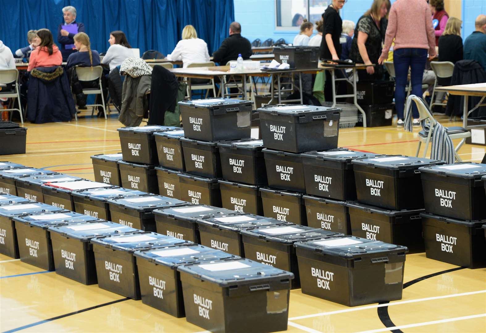 A stack of ballot boxes await checking