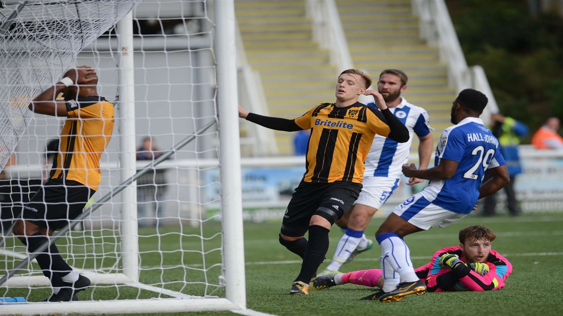 Keeper Alex Lynch clings on after Stuart Lewis' shot comes back off the post Picture: Gary Browne