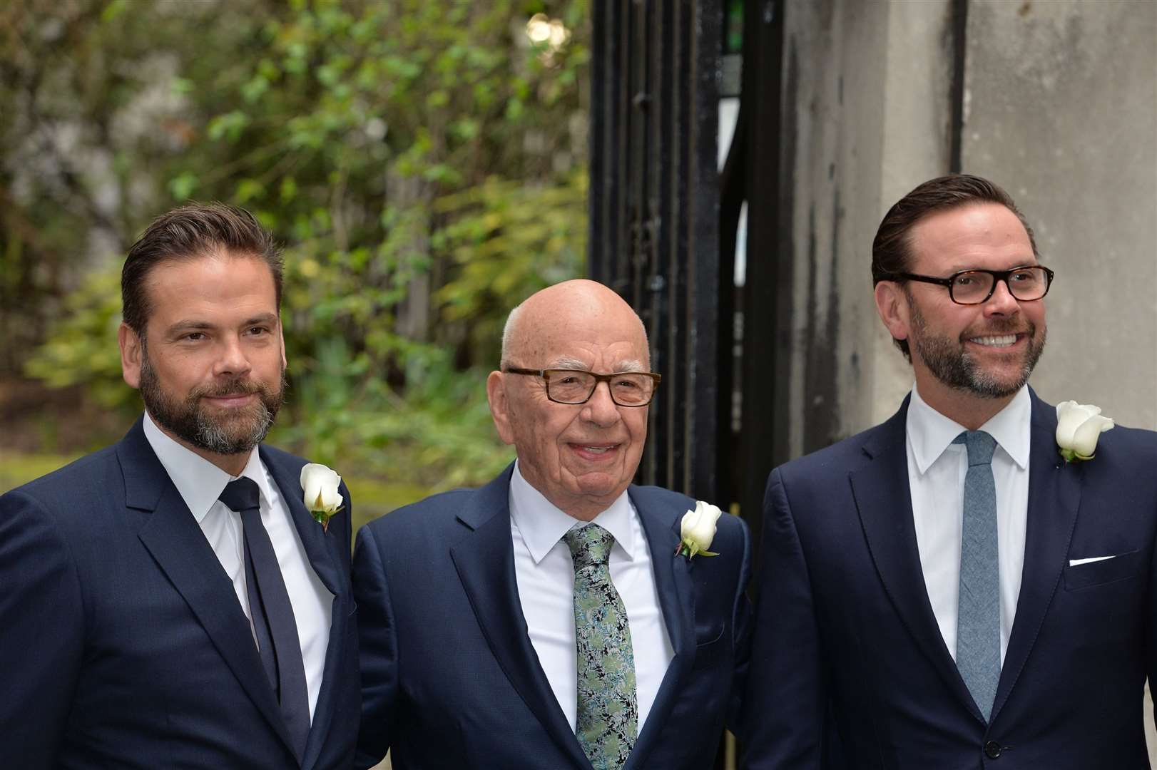 Rupert Murdoch accompanied by his sons James (right) and Lachlan (left) (John Stillwell/PA)