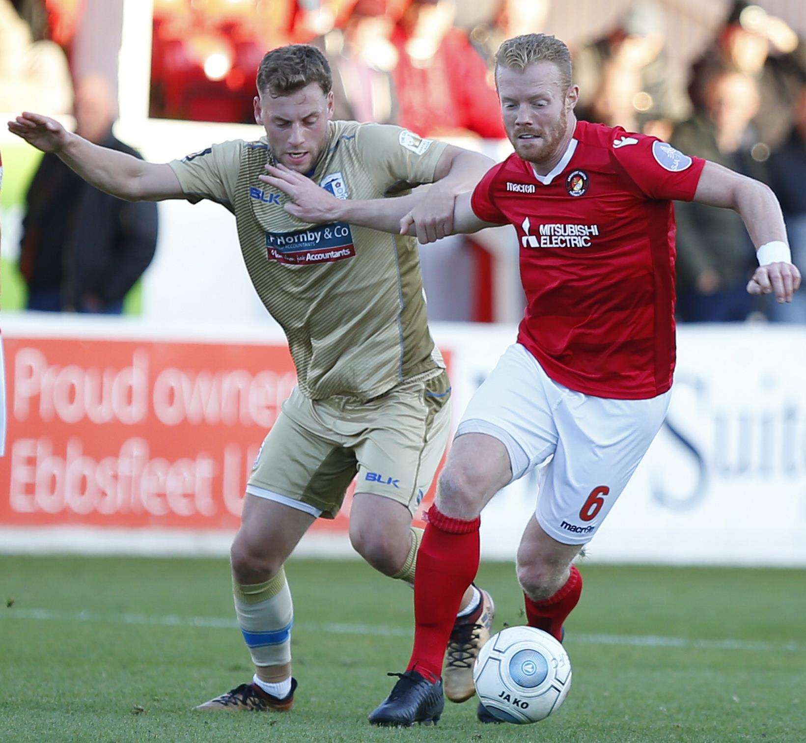 Kenny Clark keeps Barrow at arm's length Picture: Andy Jones