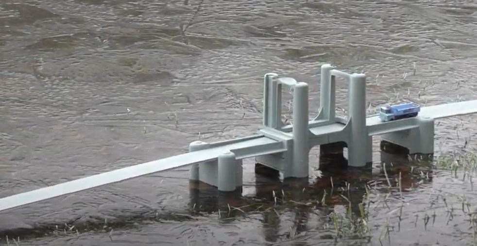 Engineer Dale Dempsey has made a model of Sheppey's Kingsferry Bridge out of two carrot slicers and installed it in his pond in Norfolk to remind him of the Island. Stills from Dale Dempsey's video