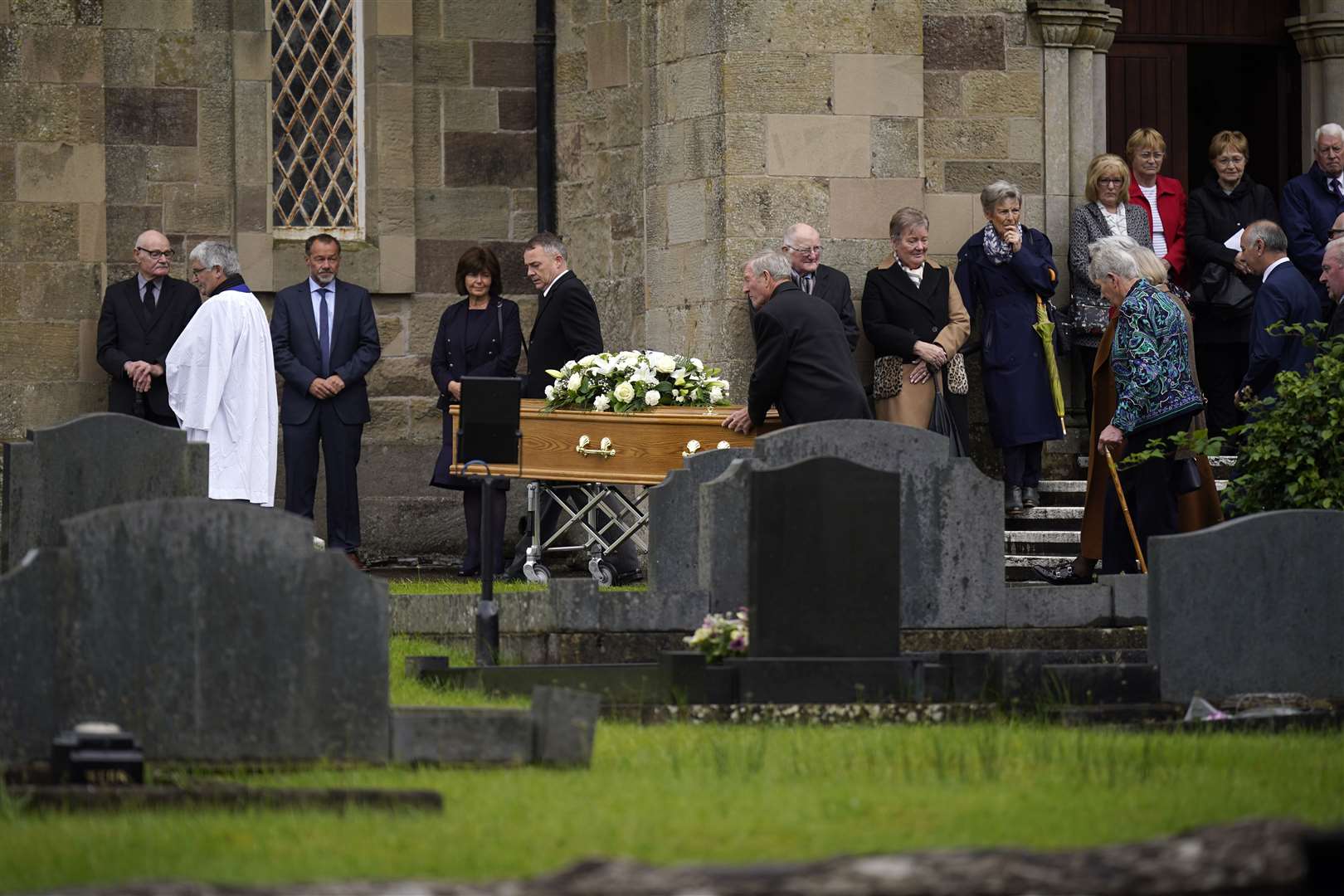 The coffin of country music star Derrick Mehaffey is taken to the graveyard at Donacavey Church of Ireland Parish Church (Niall Carson/PA).