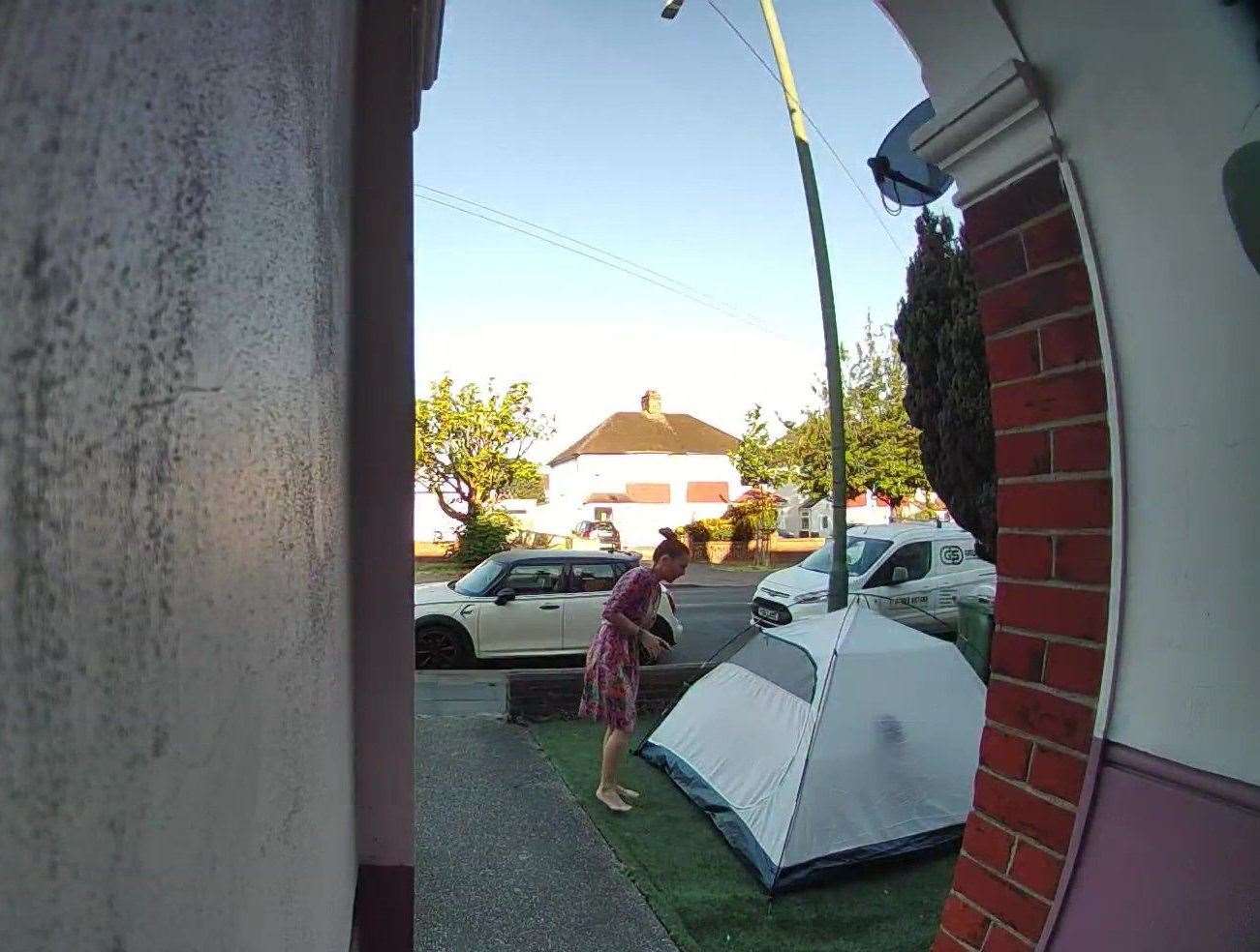 Erika White "couldn't believe the audacity" of the sleepy camper on her front lawn. Picture: SWNS