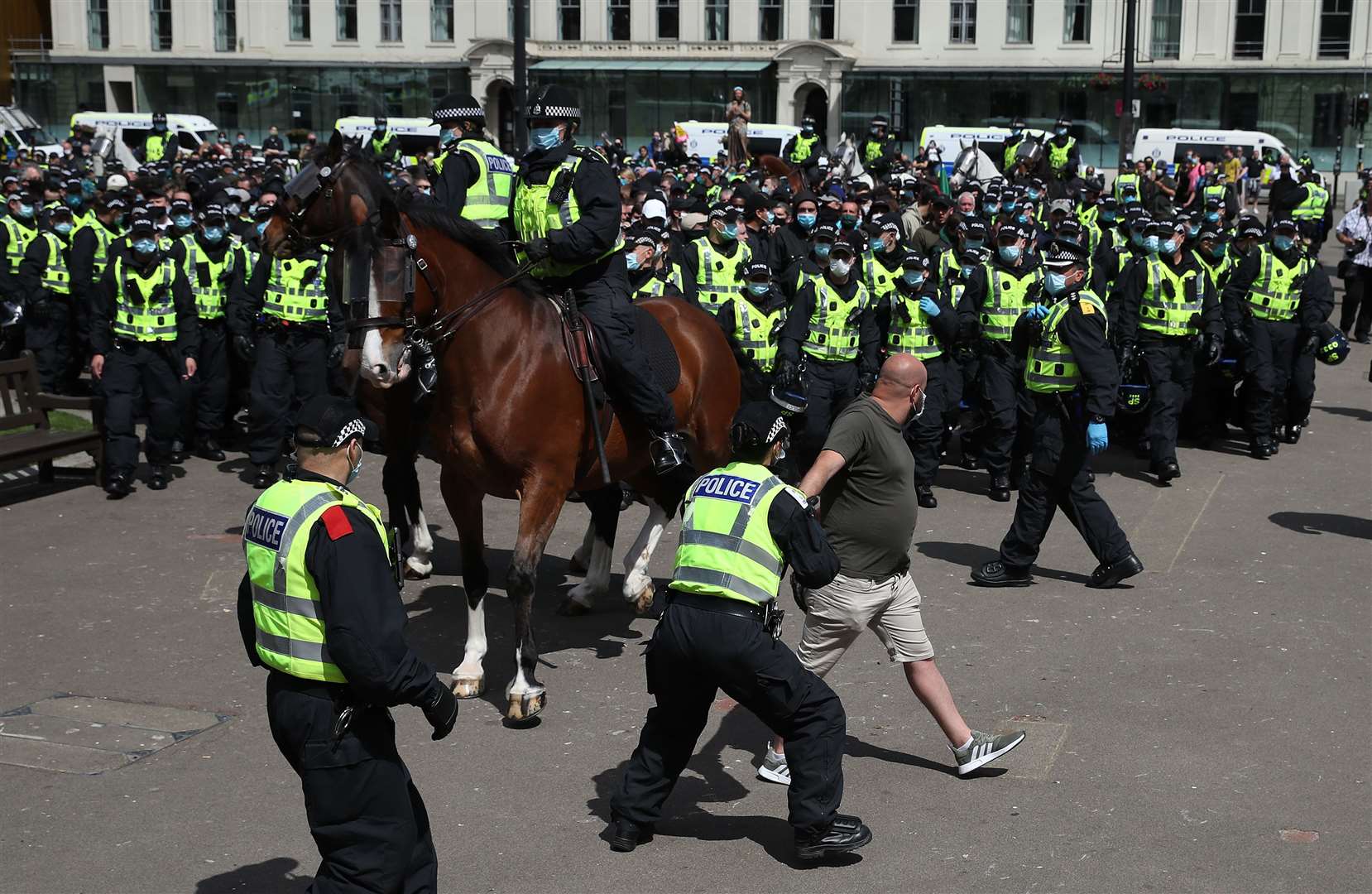 Police horses being used to kettle supporters (Andrew Milligan/PA)