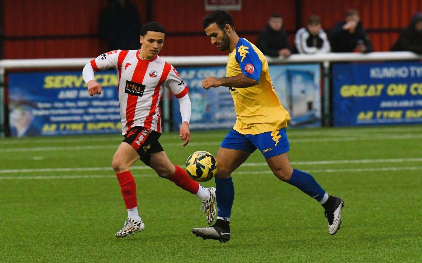 Kieron McCann of Faversham is closed down by Sheppey player Eddie Allsopp in the weekend 2-2 draw at Holm Park. Picture: Marc Richards