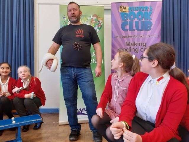 Michael Tyler with two Creepy Claws critters at Painters Ash Primary School (30609635)