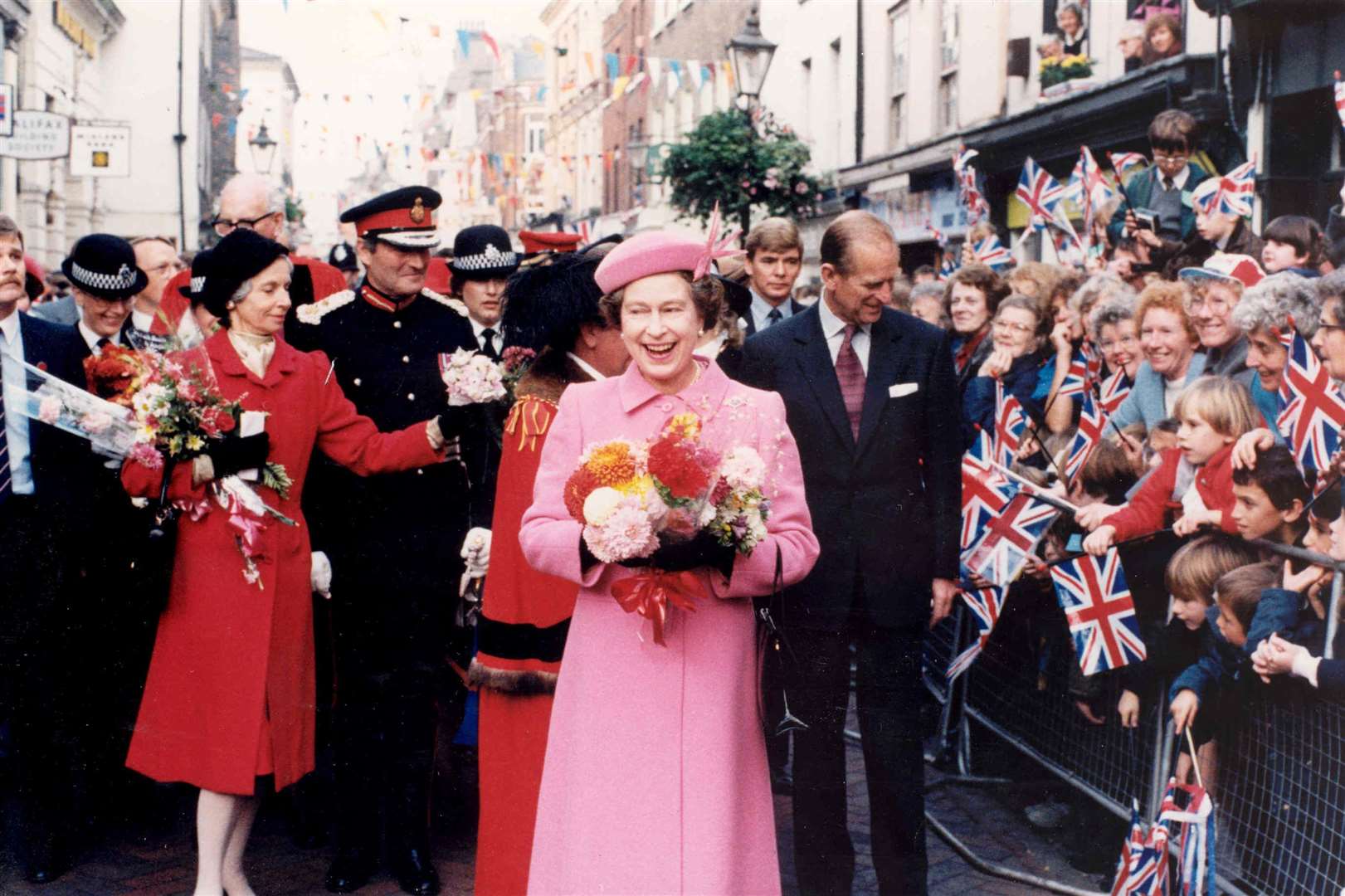 The Queen delighted the crowds in Rochester High Street during a tour of the Medway Towns in October 1984 which included visits to the Molly Wisdom Hospice, Rochester's Corn Exchange, Chatham Dockyard and Gillingham Business Park. Picture: Kent Our Century by the People Who Lived It