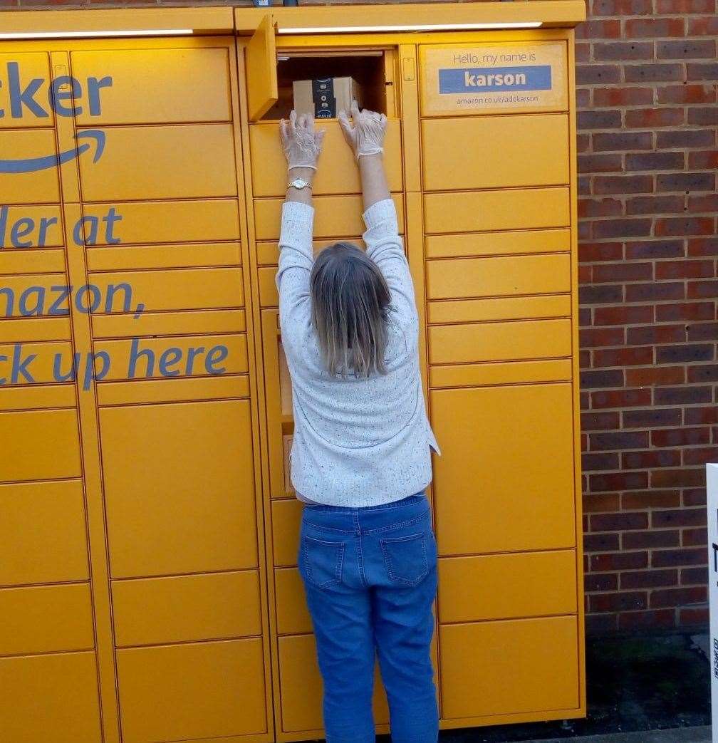 The moment Hilary Broad, 66, cannot reach her parcel. Picture: Nigel Hall