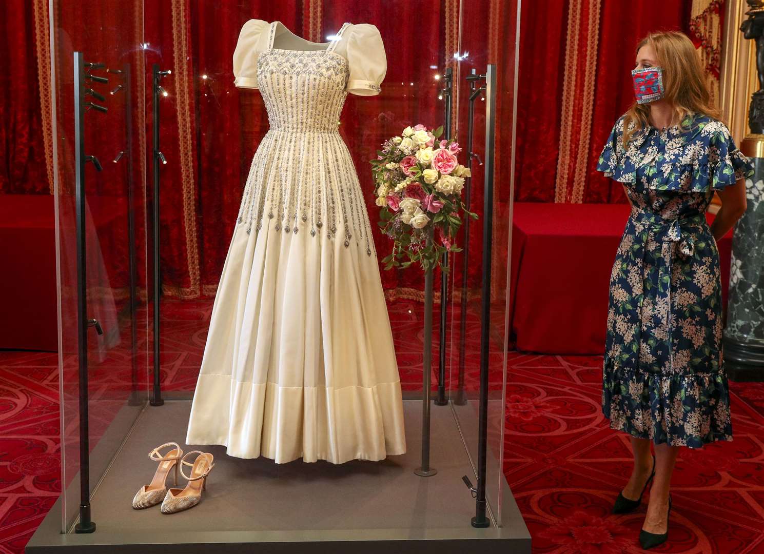 Princess Beatrice with her wedding dress as it went on display at Windsor Castle. Beatrice married Edoardo Mapelli Mozzi in July (Steve Parsons/PA)