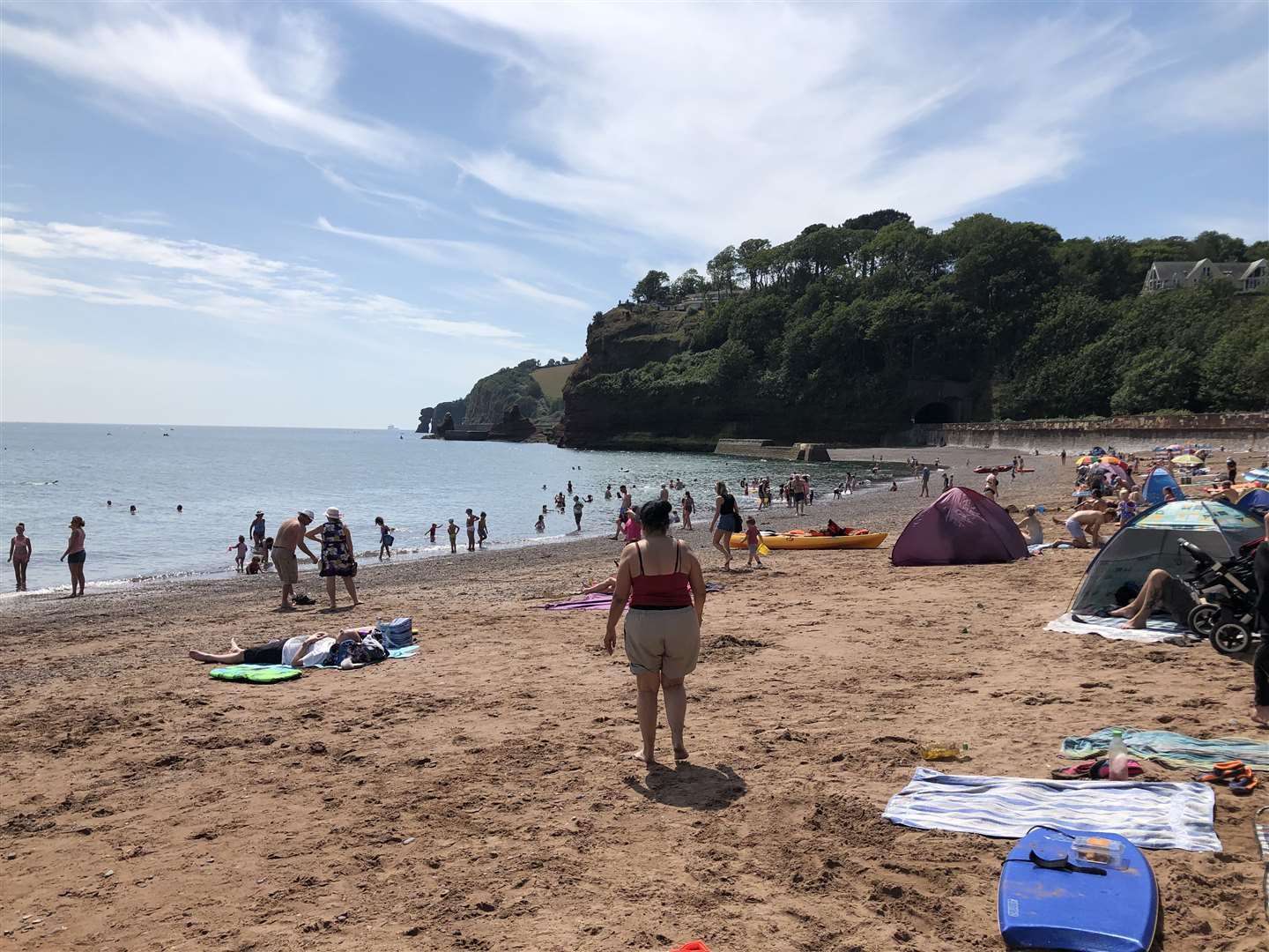 People enjoy the hot weather in Coryton Cove, Dawlish, Devon (Pat Hurst/PA)