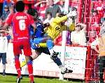 Mark McCammon barges the keeper. Picture: Matthew Walker