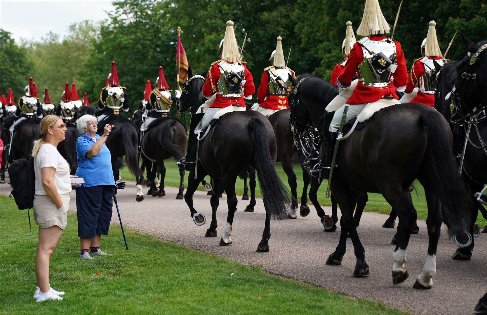 Members of the Household Cavalry make their way down the Long Walk towards Windsor Castle ahead of the ceremony (Andrew Matthews/PA)