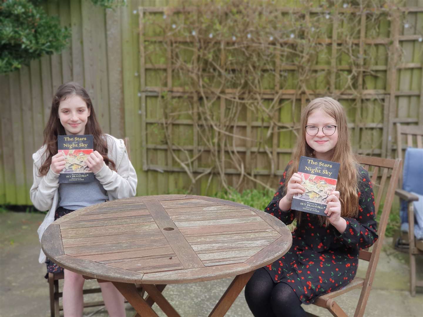 Sky Bradford, 11, (left) with illustrator Natalie Starr,