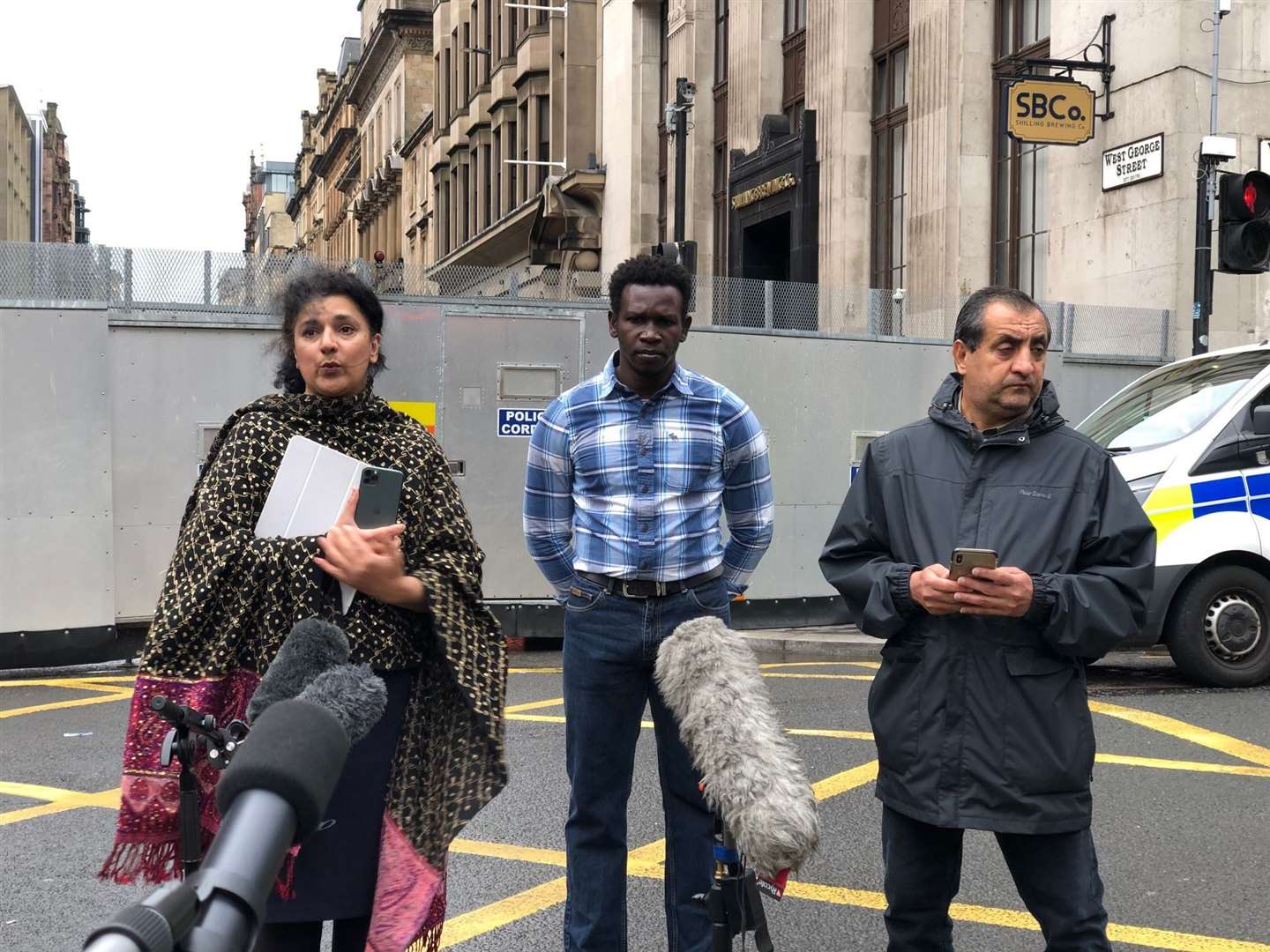 Robina Qureshi, from Positive Action In Housing; with Andrew (centre) and Mohammad Asif (Douglas Barrie/PA)