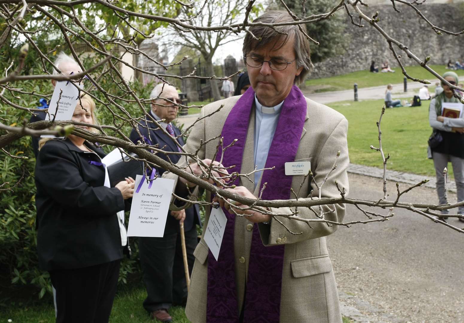 An annual Unison workers memorial day service held at the Castle Gardens. Pictredm Rev David Helms leaving messages on the tree. Picture: Peter Still