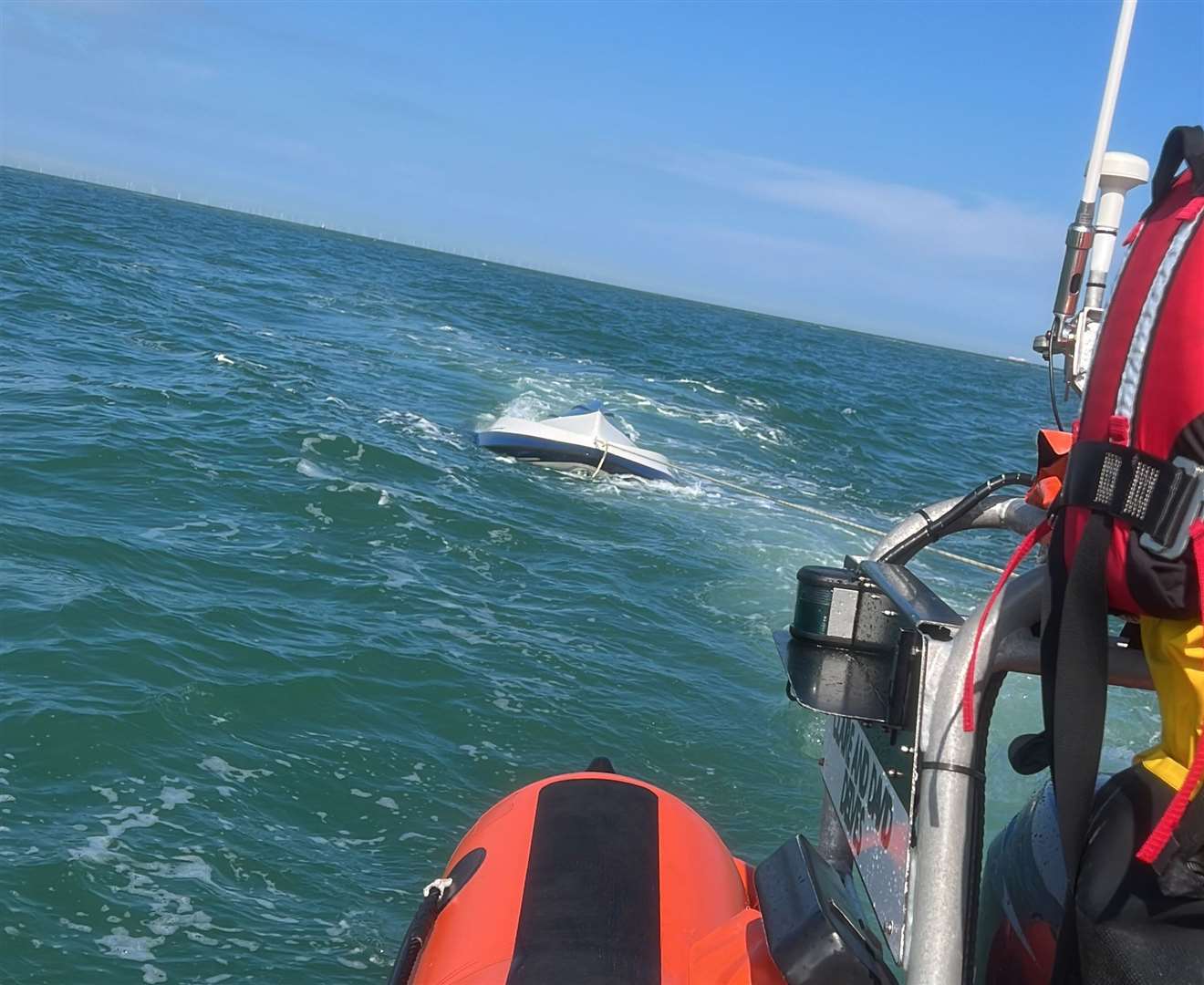 The Taylors' boat being towed by the RNLI off the coast of Ramsgate. Picture: Ellis Taylor