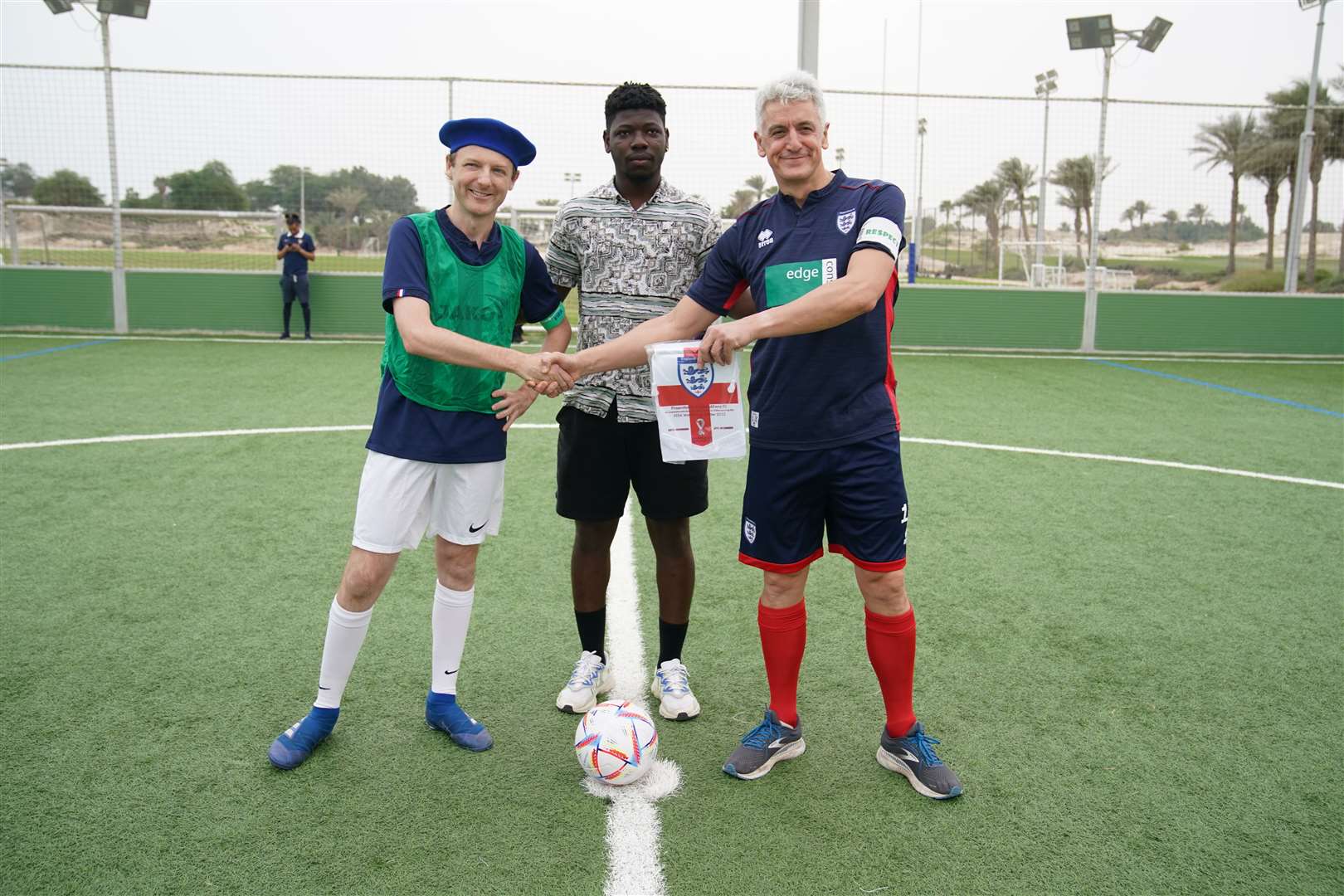 England supporters playing French supporters in a seven-a-side game in Doha (Peter Byrne/PA)