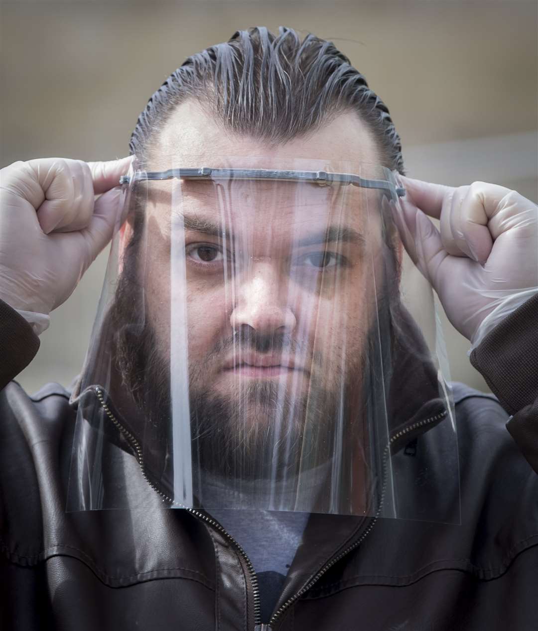 Sid Lovatt with a 3D printed protective mask that he has been supplying to front-line workers (Danny Lawson/PA)