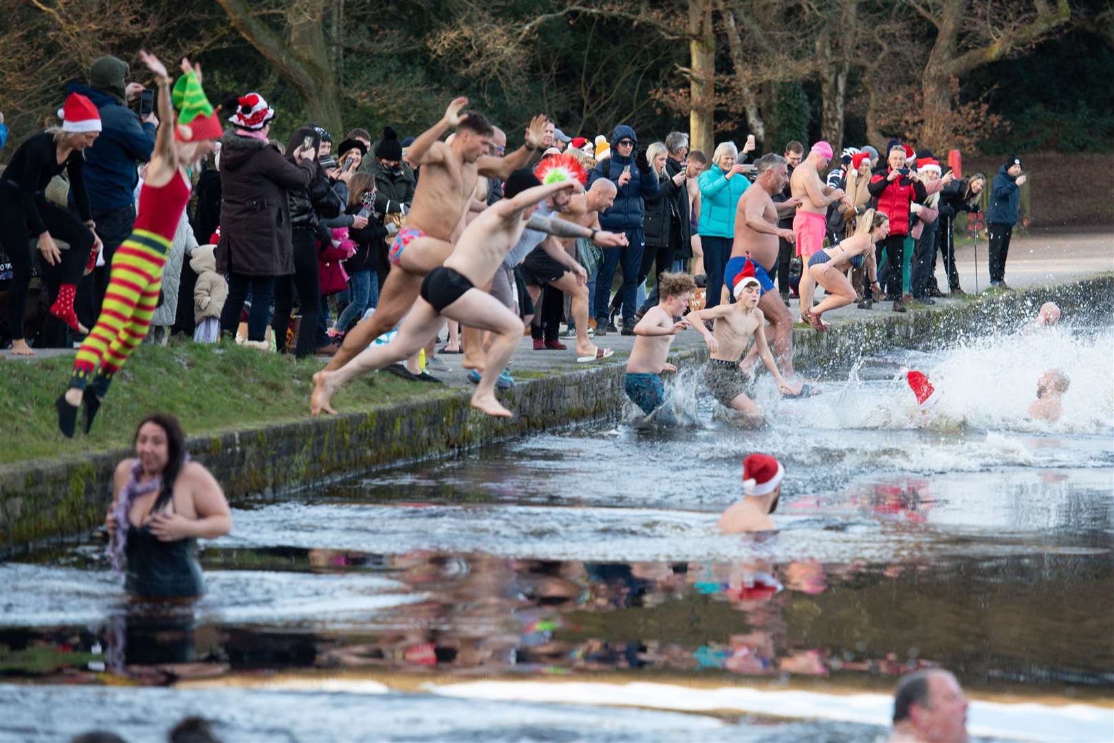 In Birmingham, swimmers leaped into Blackroot Pool at Sutton Park in Sutton Coldfield (Jacob King/PA)