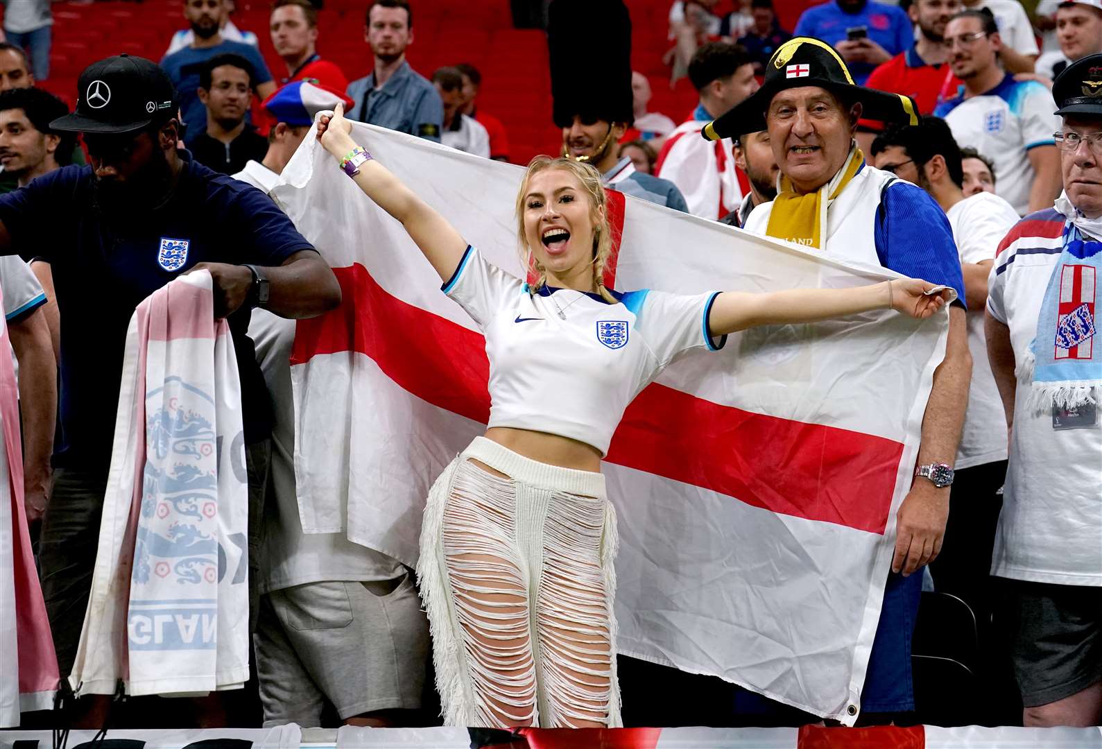 England fans celebrate in Qatar (Martin Rickett/PA)