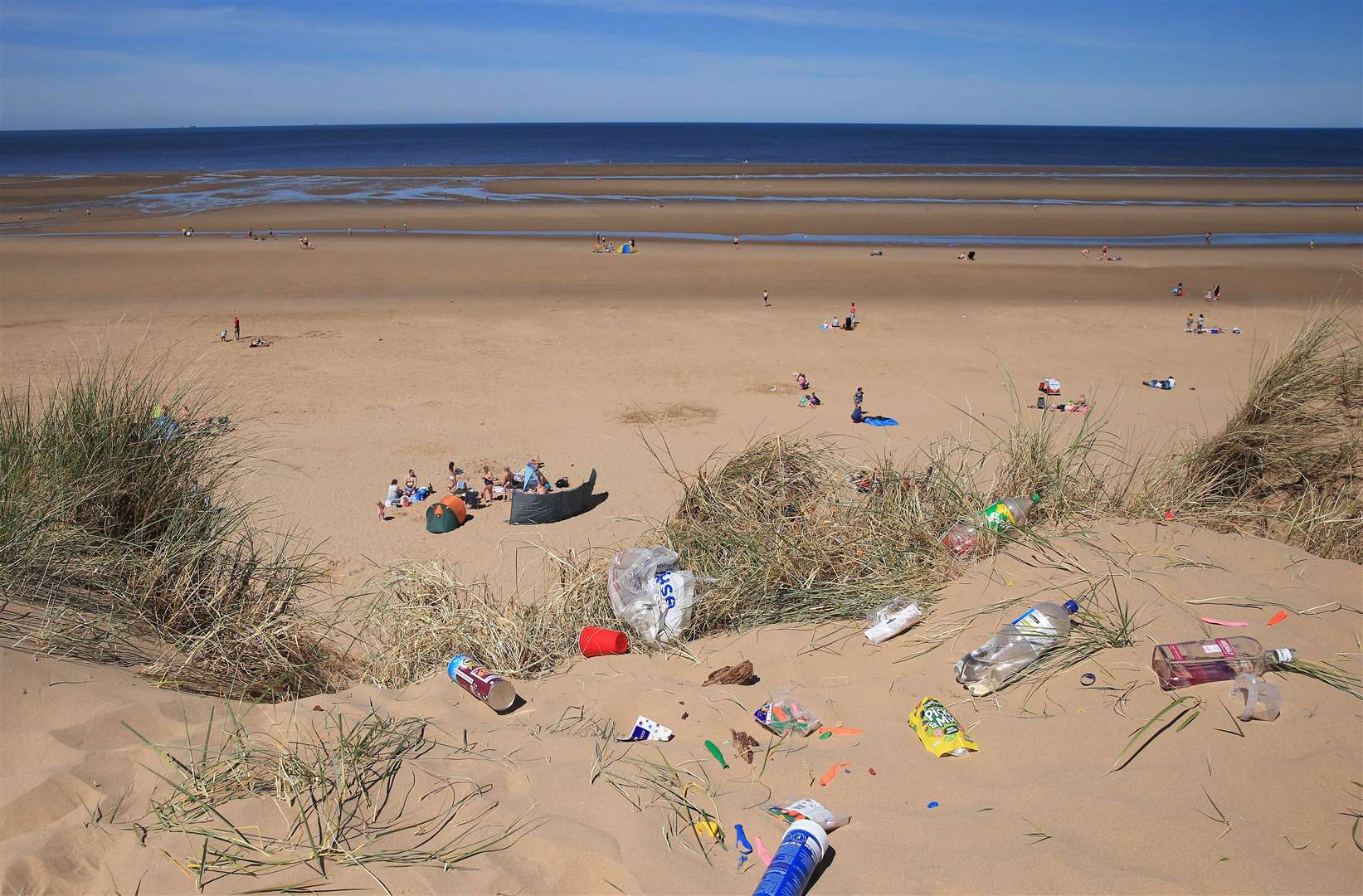 People are being encouraged to pick up and record litter on a 100m stretch of beach (Peter Byrne/PA)