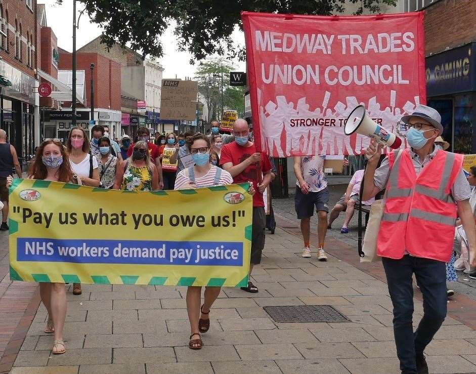 Protesters in Chatham held a sign urging the government to "pay them what they owe them". Picture: MTUC (40252387)