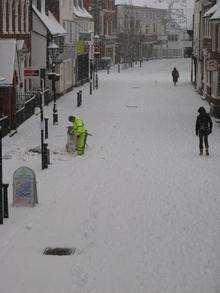 A worker collects rubbish