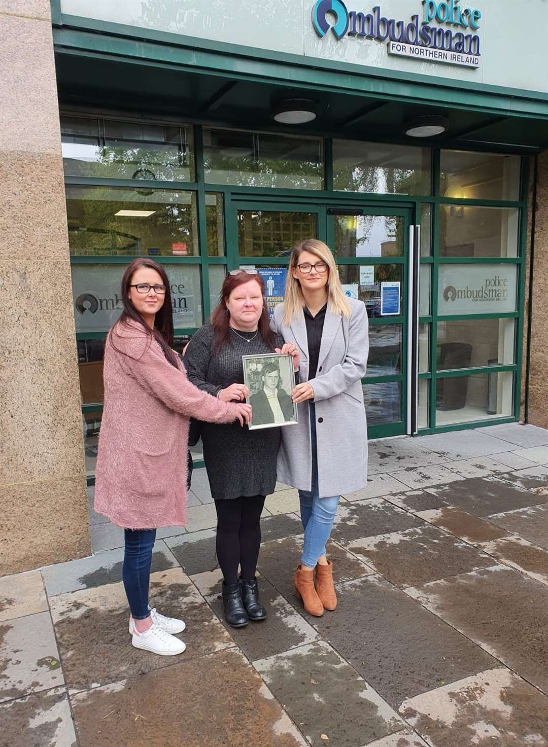 Hugh McCabe’s daughter, Liz McCabe (centre) and two of his granddaughters, Caoimhe Bradley and Claire McCabe (Relatives for Justice)