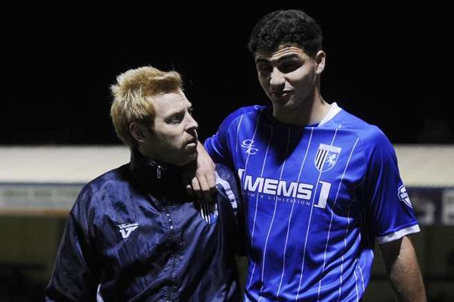 Ryan Inniss leaves the field after being injured in his Gills debut against Sheffield United. Picture: Barry Goodwin