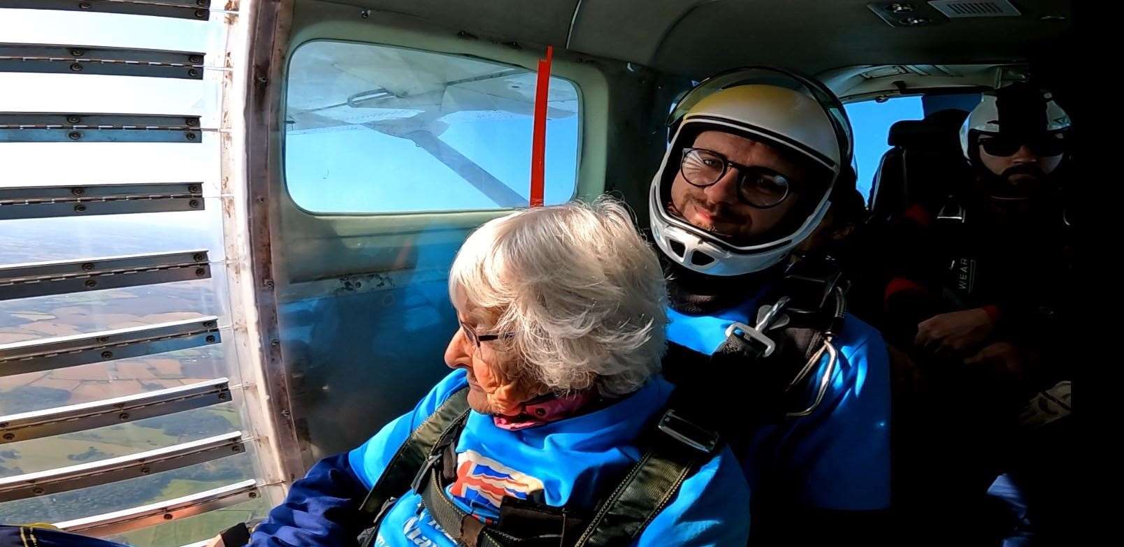 Manette Baillie prepares to leap out of the plane (UK Parachuting and Goldster/PA)