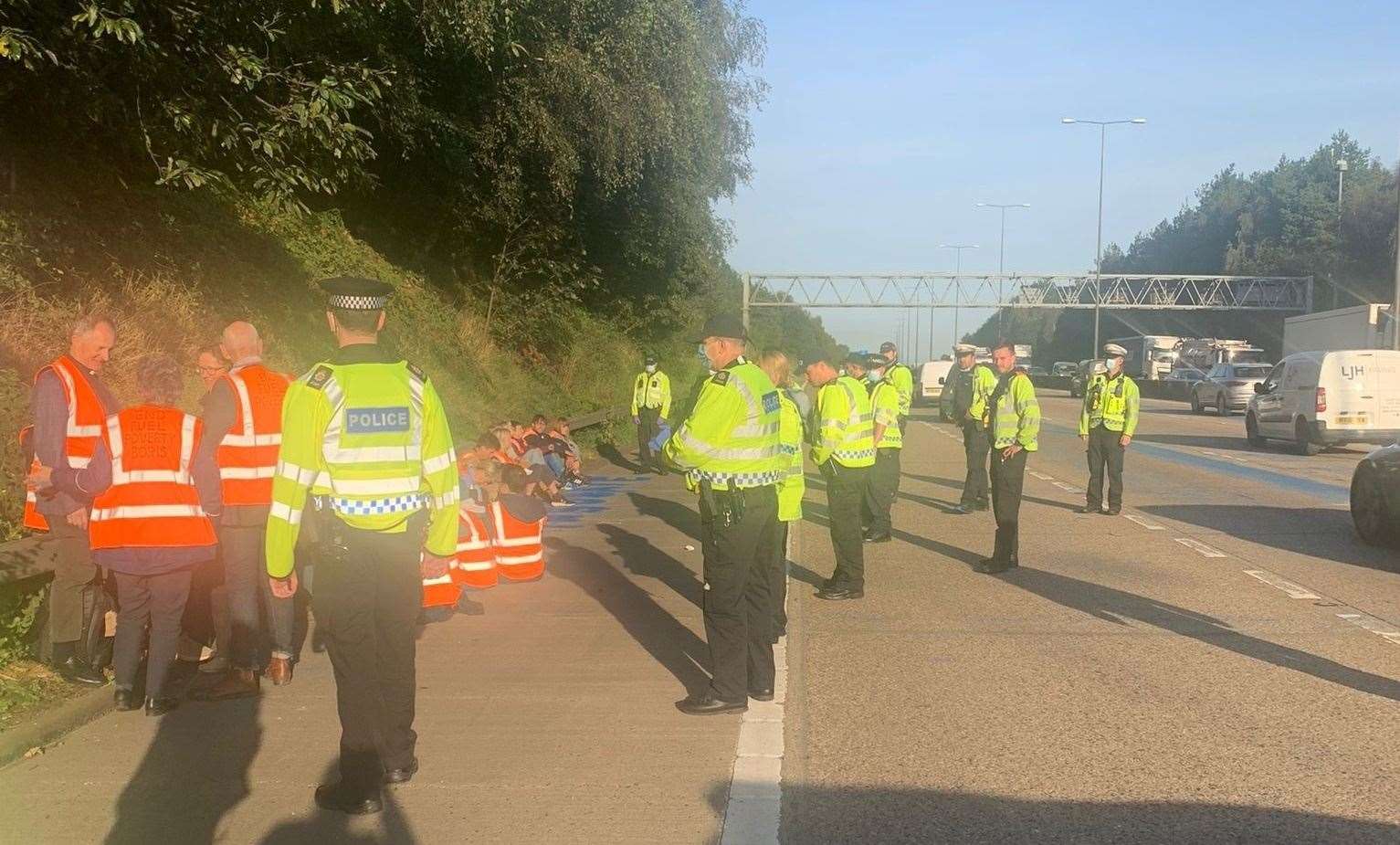 Police detain protesters at Junction 10 Picture: Surrey Police