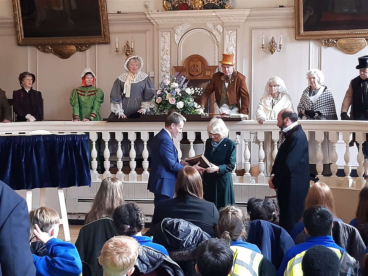 The Duchess of Cornwall reading an extract from Great Expectations to school pupils