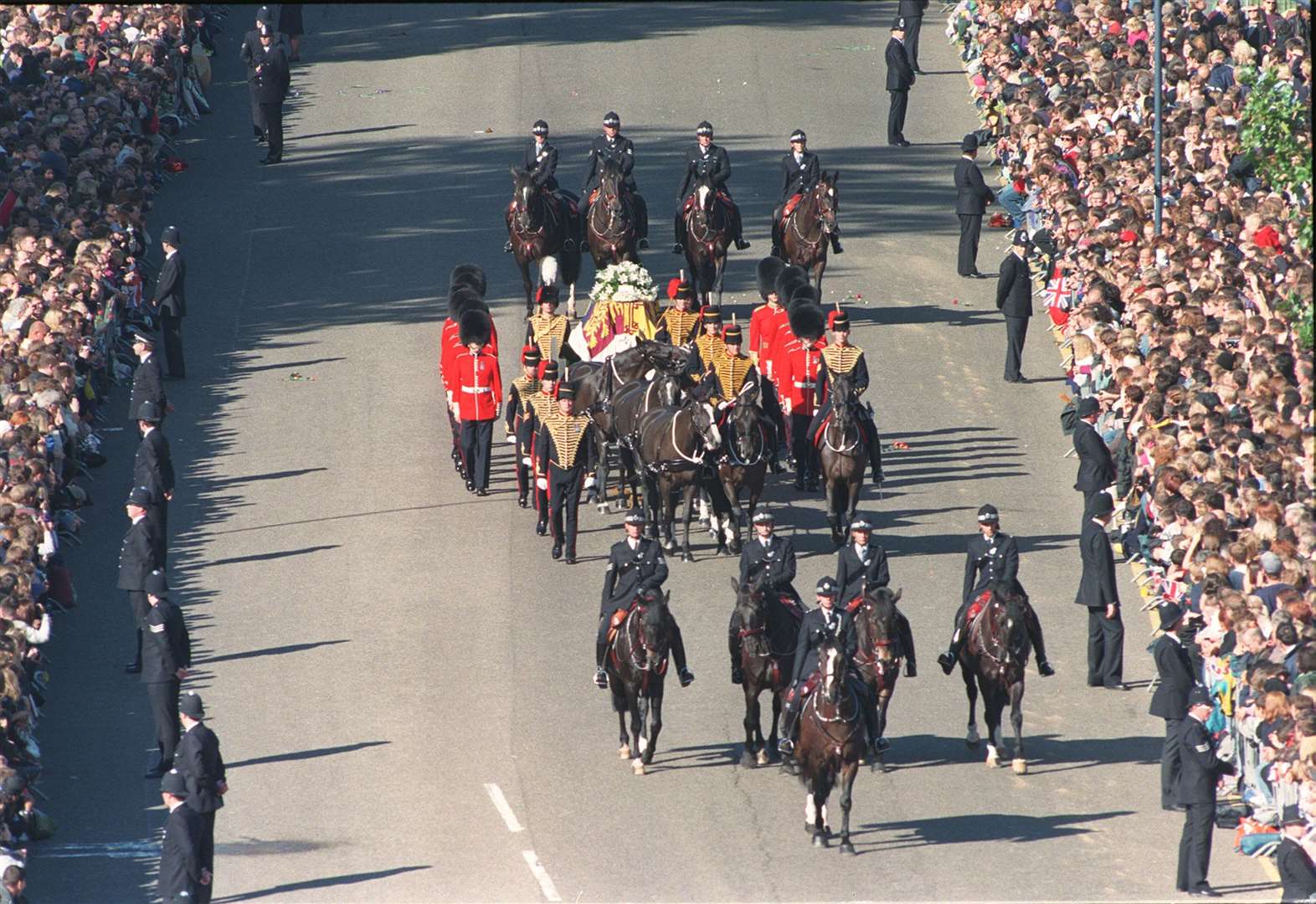 The coffin of Diana, Princess of Wales lies on a gun carriage flanked by the bearer party of Welsh Guardsmen as it travels to Westminster Abbey, 1997 (Stefan Rousseau/PA Archive/PA)