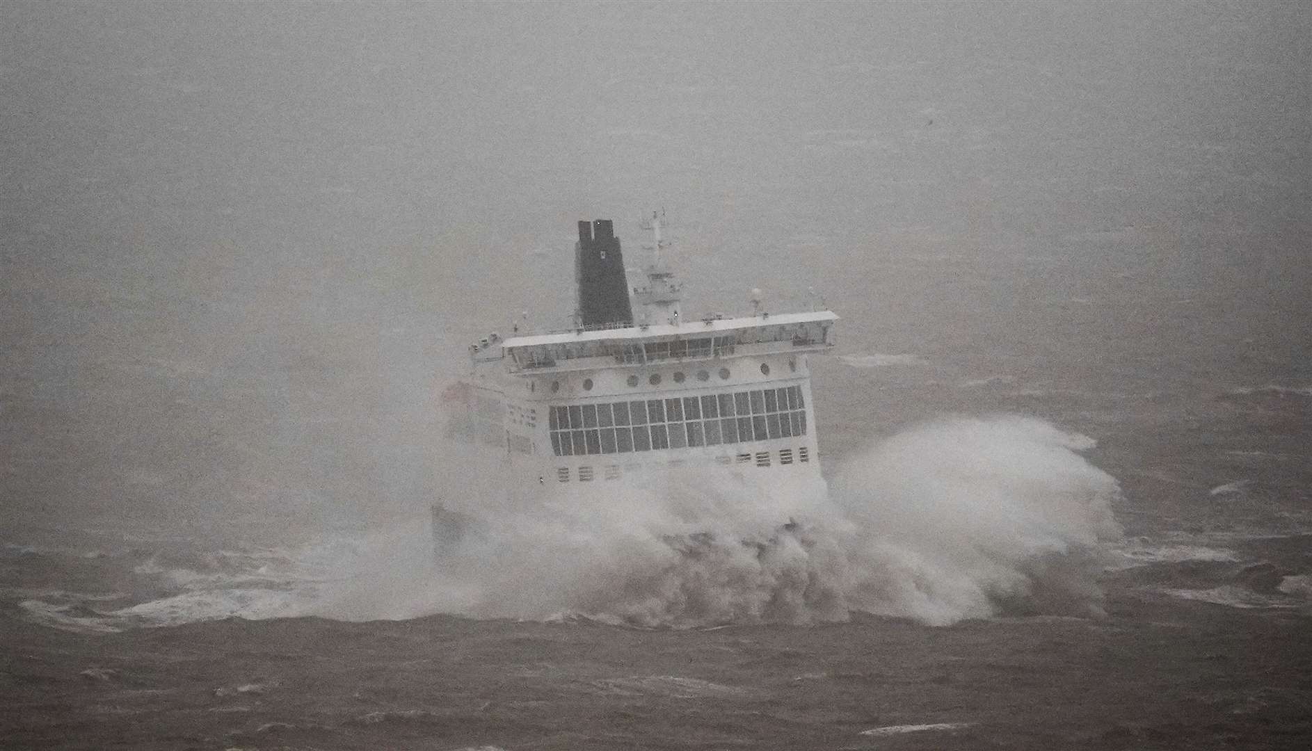 A DFDS ferry arrives in stormy conditions at the Port of Dover in Kent (Gareth Fuller/PA)