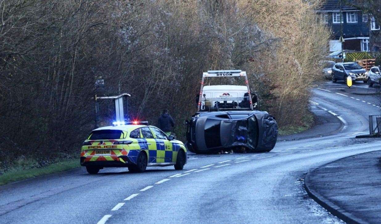 A car flipped on its side after crashing in Walderslade Road, Walderslade, near the Co-Op. Picture: UKNIP