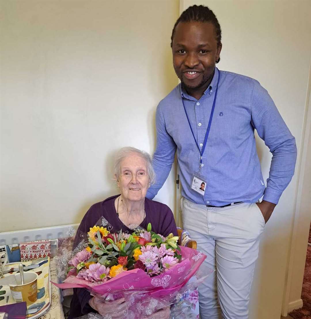 Second World War codebreaker Joan Alexander celebrates her 100th birthday with Bluebird Care Gravesham & Dartford Care Supervisor, Neville Madera