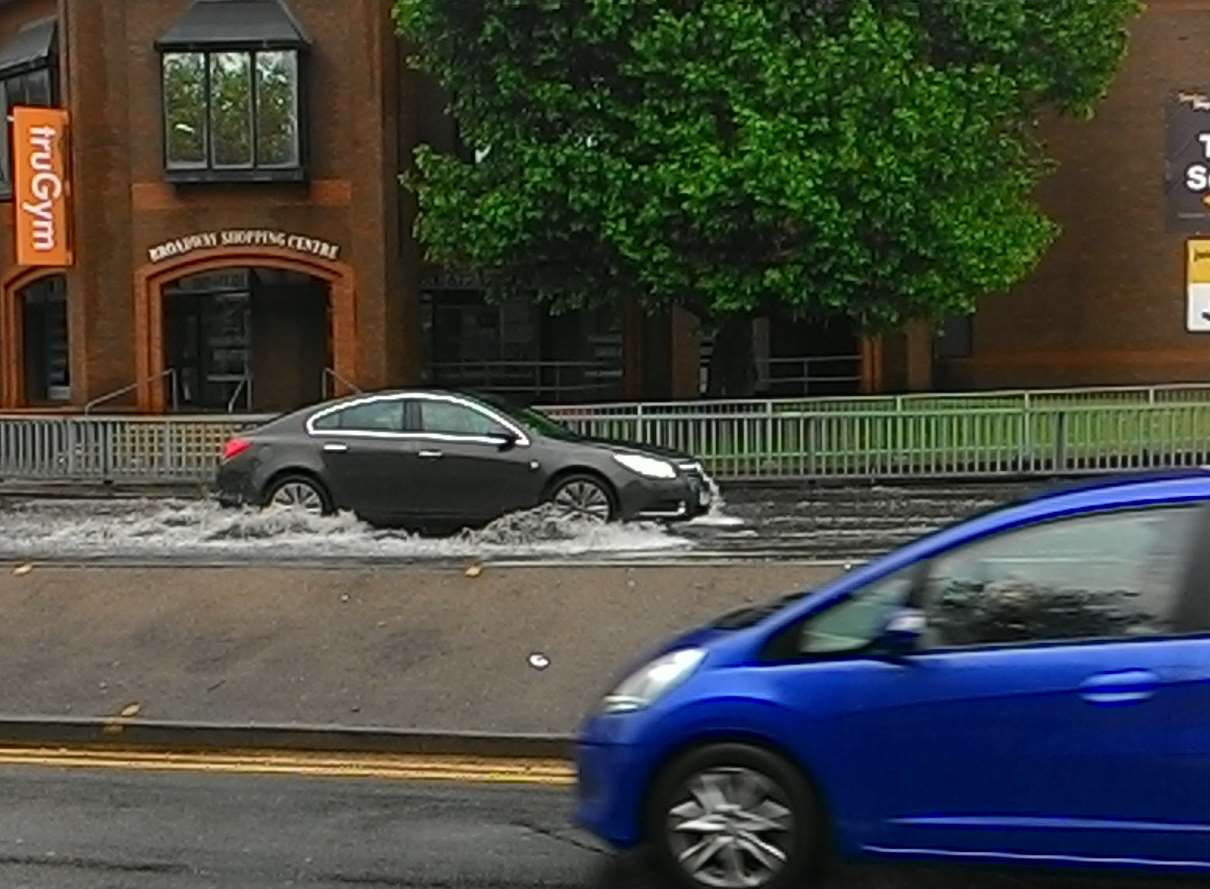 Water is several inches deep on the A20 Broadway heading into Maidstone's town centre