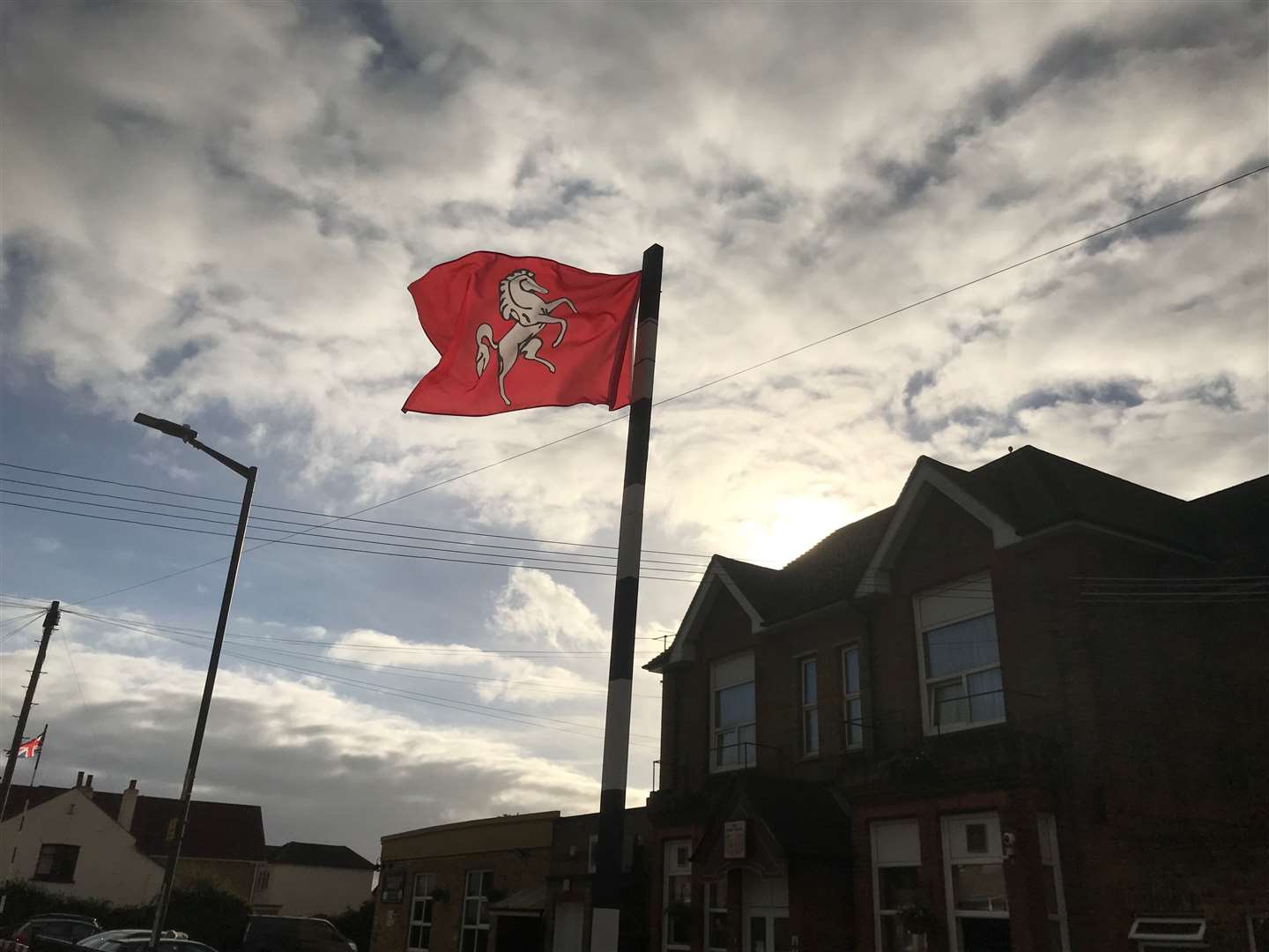 The flag of Kent flying at Hoo Village Institute